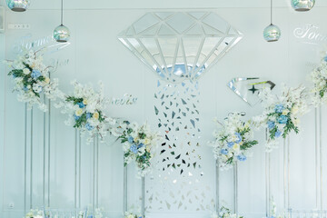 Beautiful wedding arch of flowers for the newlyweds. Decoration on a holiday