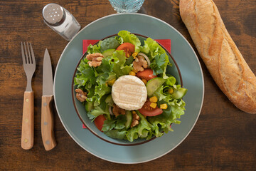 salad with walnuts, vegetables and goat cheese