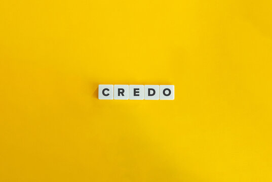 Credo Word on Letter Tiles on Yellow Background. Minimal Aesthetics.