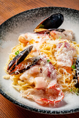 seafood pasta with vegetables and cheese
