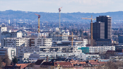 View over the skyline of Graz during Winter with the city development area Reininghaus under construction