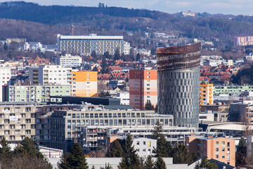 View over the skyline of Graz during Winter with the Smart Tower in the new city development area...