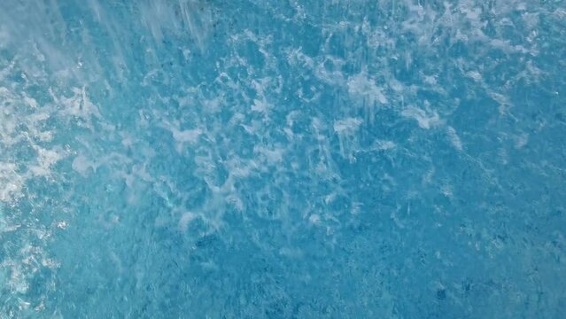 Water drop in swimming pool. Blue color. Stop motion video. H2O hotel relax. Sea wave summer texture. Crystal wet waves. Float calm splash. Nobody liquid background