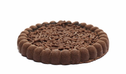 Cocoa biscuit with orange jelly and chocolate sprinkles isolated on white 