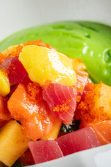 Raw fish poke bowl  with sauce