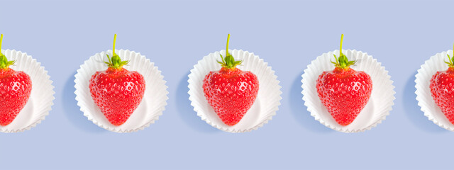 Seamless Pattern of strawberries in white paper baskets on a purple background