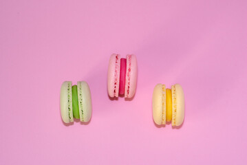 Macaroni with sweet almonds or dessert cake made of almond cookies, painted in the fashionable color of 2022. Very beautiful background.