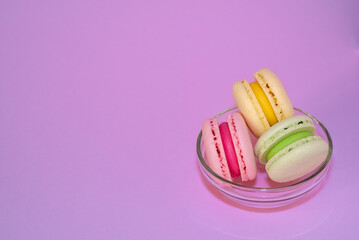 Macaroni with sweet almonds or dessert cake made of almond cookies, painted in the fashionable color of 2022. Very beautiful background.