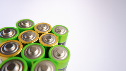 Several AA batteries close-up photo. Used Batteries , Waste, Collection And Recycling. Closeup of pile of alkaline batteries. Energy supply and storage, electro-waste and recycling concept