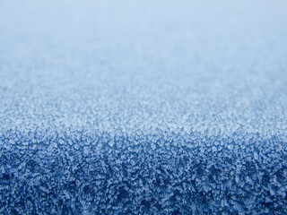 Blue frost texture. thawed hoarfrost gradient frost pattern on surface. pastel blue abstract background