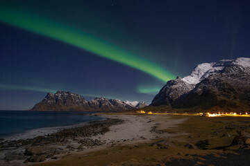 Aurora Borealis on sky in Flakstad island, Lofoten archipelago