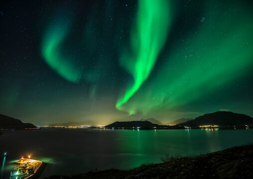 Aurora Borealis on sky in Flakstad island, Lofoten archipelago