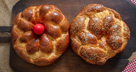 Easter Sweet bread, Greek tsoureki braid top view. Baked brioche on old rustic baker shovel wood