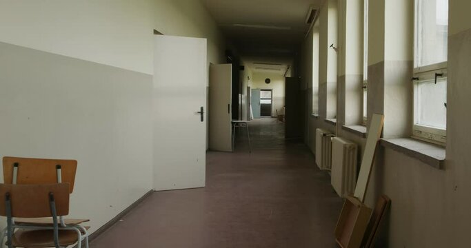 Camera move in an old school hallway, the School is emty and abandoned from the east germany

