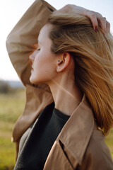 Young woman enjoys a spring sunny day. People, lifestyle, travel, nature and vacations concept.