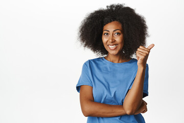 Very good. Smiling pleased adult woman shows thumbs up in approval and nod, satisfied with quality,...