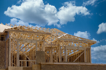 Installation of frame trusses joining with wooden beams at construction