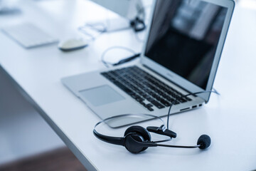 Headset and customer support equipment at call center ready for actively service . Corporate...