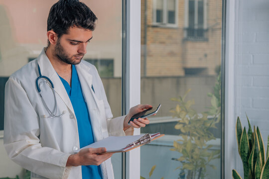 Doctor With Mobile Phone In Hands