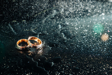 Holding wedding rings. Noble metal jewellery for married couples.Wedding ceremony and planing.Holding traditional bridal commitment jewellery.Golden ring for bride and groom.Marriage proposal exchange