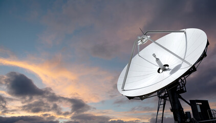 Big parabolic antenna against dramatic sky