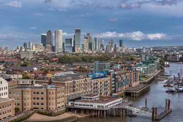 Obraz premium London's St Katharine's district with the Thames River and the skyscrapers of the Docklands in the background.