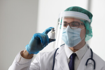 Professional medical doctor in hospital office. Portrait of young and confident physician. Medical...