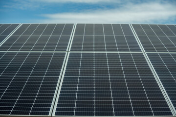 Field of solar panels to generate green and sustainable energy for the industries in the area.