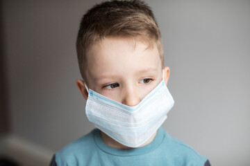 Boy wear mask for protection flu virus. Quarantine.