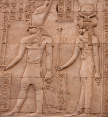Ancient relief with Horus God and Hathor Goddess of Kom Ombo temple in Aswan Governorate, Upper...