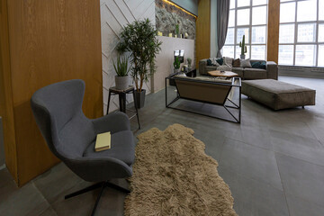 modern studio interior with decorative stone walls in grey. stone wood, tiles and led lighting in the design of the room