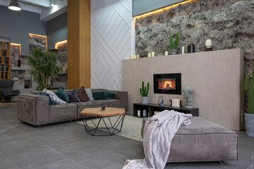 modern studio interior with decorative stone walls in grey. stone wood, tiles and led lighting in...