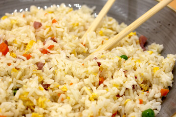 Chinese rice 3 delicacies with chopsticks