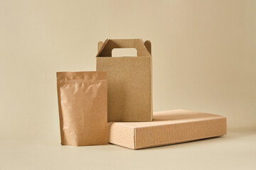 boxes and paper zip bags on a beige background, mock-up packaging for products, packages for...