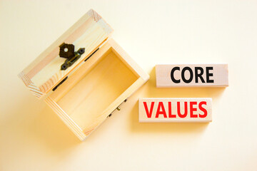 Core values symbol. Concept words Core values on wooden blocks on a beautiful white table white background. Empthy wooden chest. Business value and core values concept, copy space.