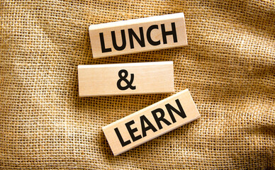 Lunch and learn symbol. Concept words Lunch and learn on wooden blocks. Beautiful canvas table...