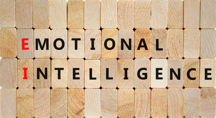 EI emotional intelligence symbol. Concept words EI emotional intelligence on wooden blocks on a beautiful wooden background. Business EI emotional intelligence concept, copy space.