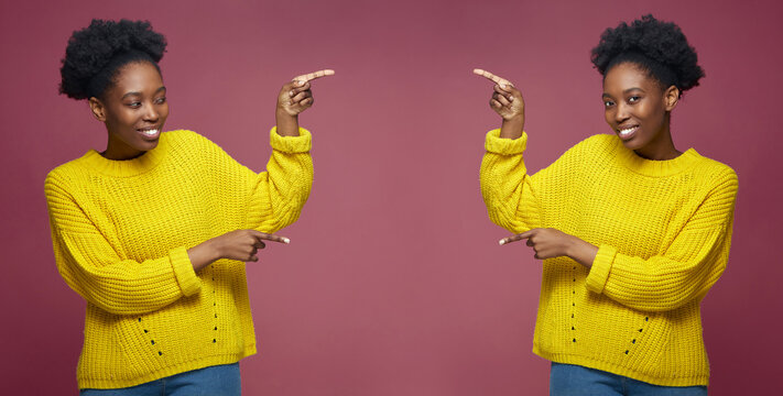 Happy Young African American Female Twins Sisters Pointing Aside On Copy Space For Online Store Advertising