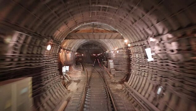 View along the subway tunnel from train driver cabin