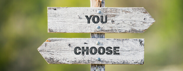 opposite signs on wooden signpost with the text quote you choose engraved. Web banner format.