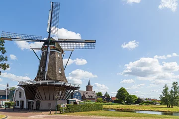 Fotobehang Dutch windmill in the fishing village of Bunschoten in the Netherlands. © Jan van der Wolf