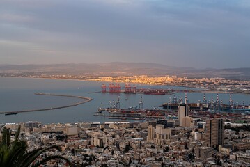 View of the Haifa Bay and surrounding area including the new harbor area, the many ships waiting to get into the harbor and buildings of Haifa, Israel.
