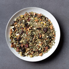 Herbal tea leaves in a bowl view from above