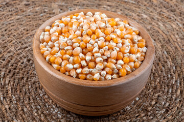 Dry corn seeds full of wooden bowl