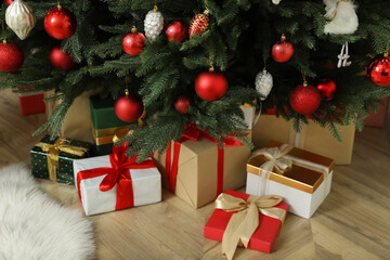 Fototapeta na wymiar Beautifully decorated Christmas tree and gifts indoors