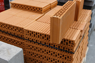 Ceramic block for laying partitions, brick.Stack of material in a store.