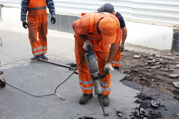 Road repair. Installation of curbs on the highway.