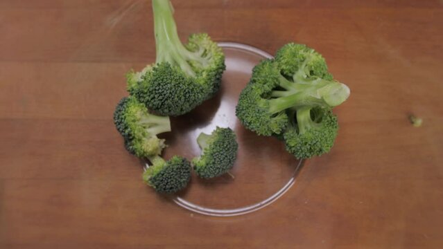broccoli falling into glass bowl slow motion 4k