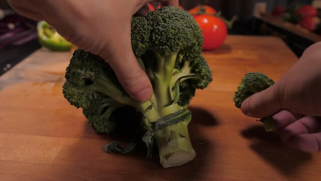 chef hands cutting broccoli slow motion 4k