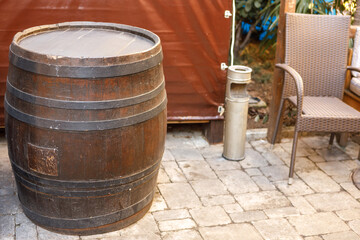 A large wooden barrel tied with metal hoops.